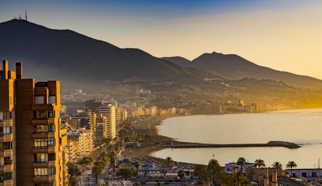Fuengirola's bay and mountains at golden hour