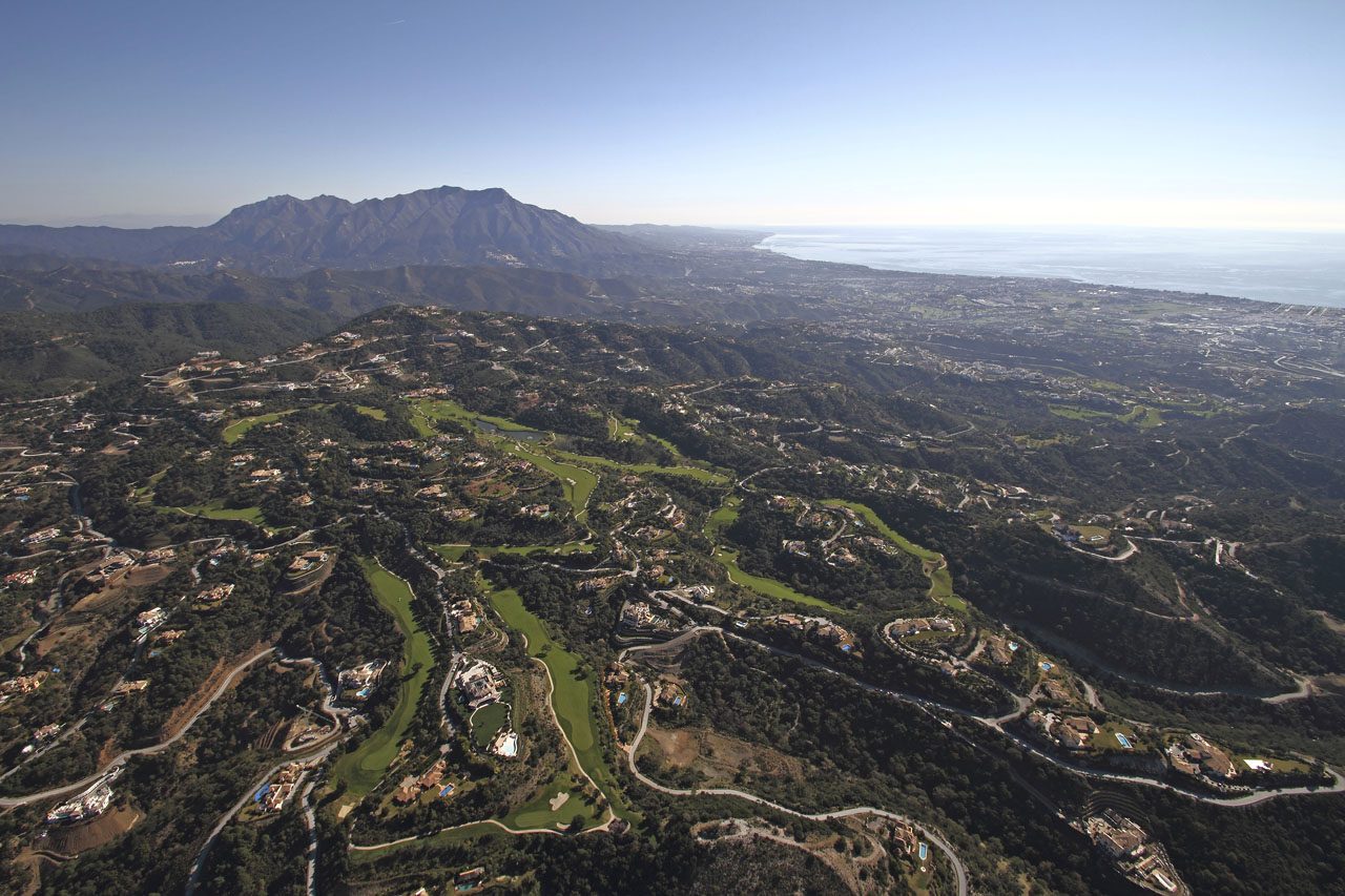 La Zagaleta's hills from the air, with the coast beyond