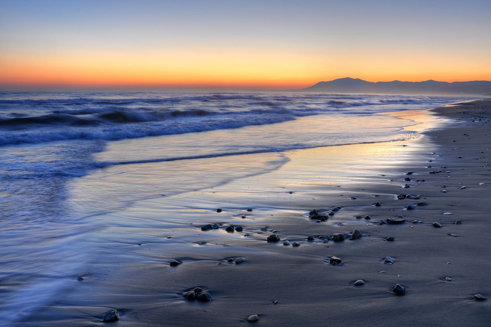 Sunset over the sea on a beach east of Marbella
