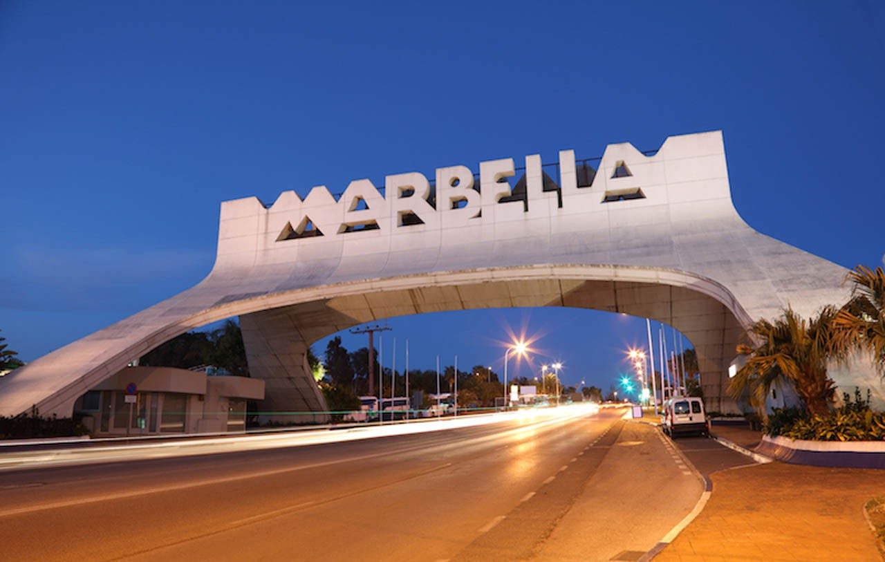 The Marbella arch at the entrance to the town at dusk