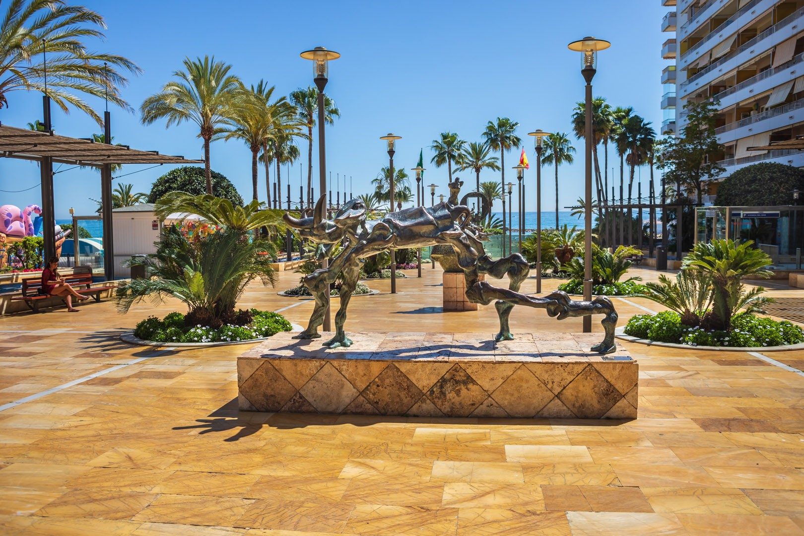 The seafront promenade in Marbella with bronze sculptures